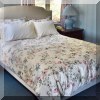 F57. Queen bed with fabric headboard. 54”h 